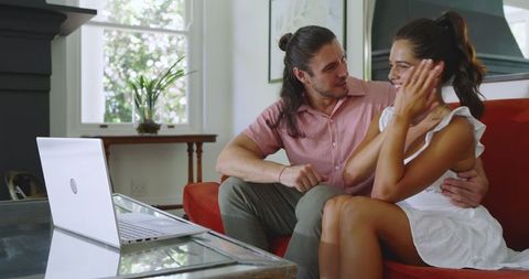 Cheerful Couple Video Chatting at Home Indoors