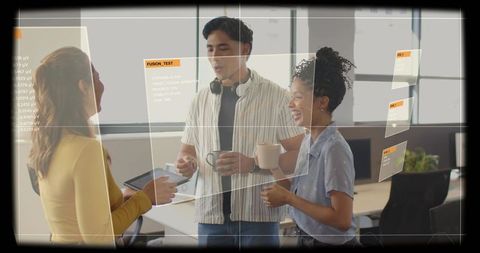 Young coworkers collaborating and discussing while holding tablets and mugs with ar panels