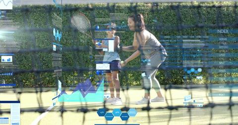 Coaching young girl in tennis with augmented analytics overlay on sunlit outdoor court