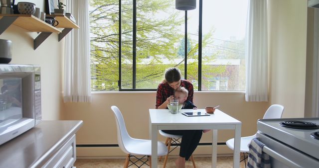 Mother and Child Eating Breakfast at Sunny Kitchen Table - Download Free Stock Images Pikwizard.com