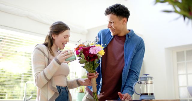 Happy Couple with Bouquet of Flowers Sharing Special Moment at Home - Download Free Stock Images Pikwizard.com