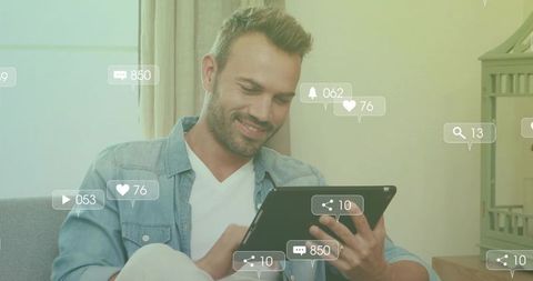 Man Engaging on Tablet with Social Media Interaction Icons