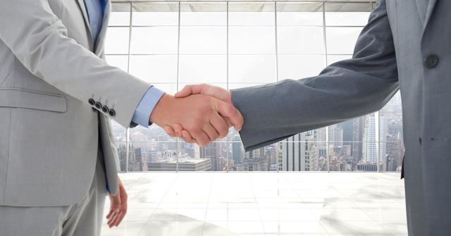 Businessmen shaking hands in a modern office with a cityscape view through large windows. Suitable for themes related to business partnerships, corporate deals, professional collaboration, and successful agreements.