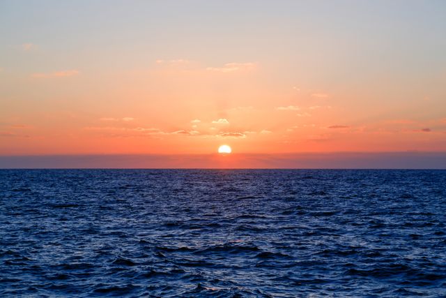 Beautiful Ocean Sunset with Vibrant Colors and Clear Sky - Download Free Stock Photos Pikwizard.com