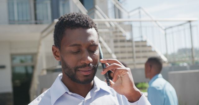 African American Man Talking on Smartphone Outdoors in Urban Setting - Download Free Stock Images Pikwizard.com