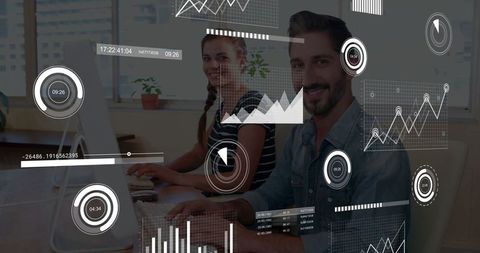 Cheerful colleagues analyzing data with virtual charts