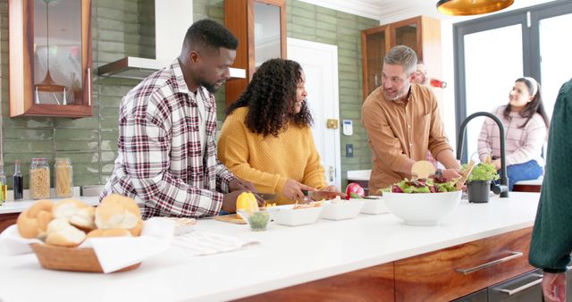 Friends preparing meal together in modern kitchen - Download Free Stock Images Pikwizard.com