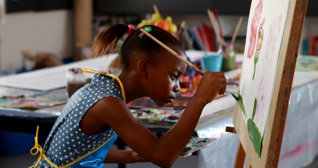 Focused Young Artist Painting on Easel in Art Studio - Download Free Stock Images Pikwizard.com