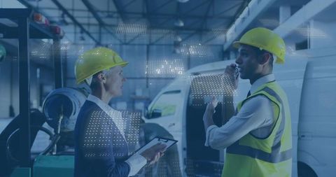 Industrial Engineers Collaborating in a Tech-Driven Warehouse