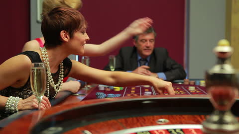 Woman Enjoying Roulette Game in Casino Setting