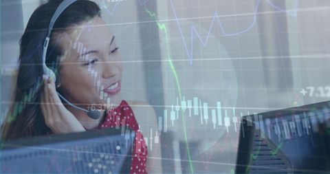 Multitasking businesswoman analyzing data with headset