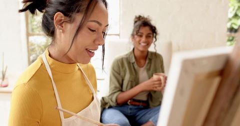 Diverse Friends Enjoying a Creative Painting Session Indoors