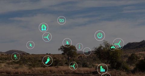 Green energy icons over desert plain signifying renewable resources