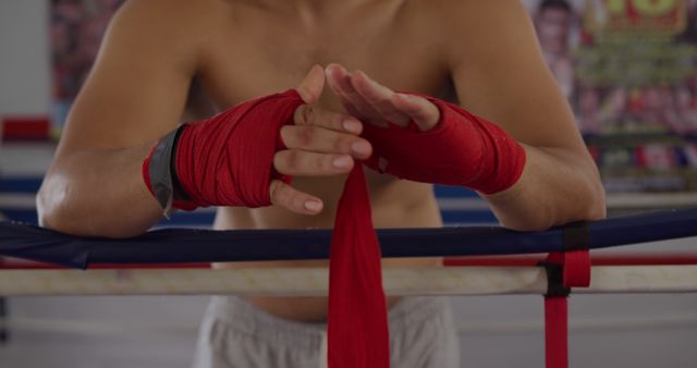 Boxer Preparing Wrapping Hands with Red Boxing Wraps - Download Free Stock Images Pikwizard.com