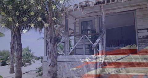 Weathered tropical beach bungalow with peeling paint, palm trees and faded flag overlay