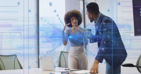 Business Professionals Discussing Digital Data with Holographic Interface