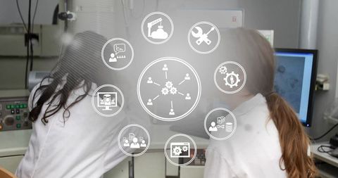 Female Scientists Analyzing Microscopy Data with Technology Interface