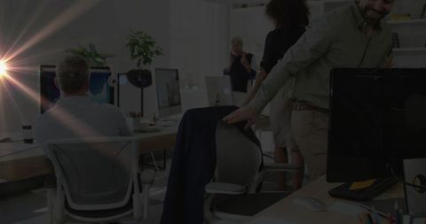 Diverse Business Team Collaborating in Modern Office with Ukrainian Flag Overlay