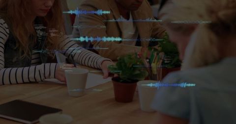 Collaborative Team Meeting with Tablet and Digital Waveform Overlays in Coworking Space