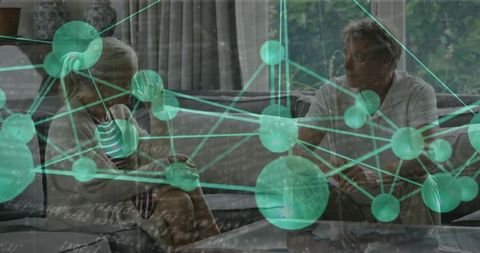 Elderly Couple Engaging with Network Data Overlay