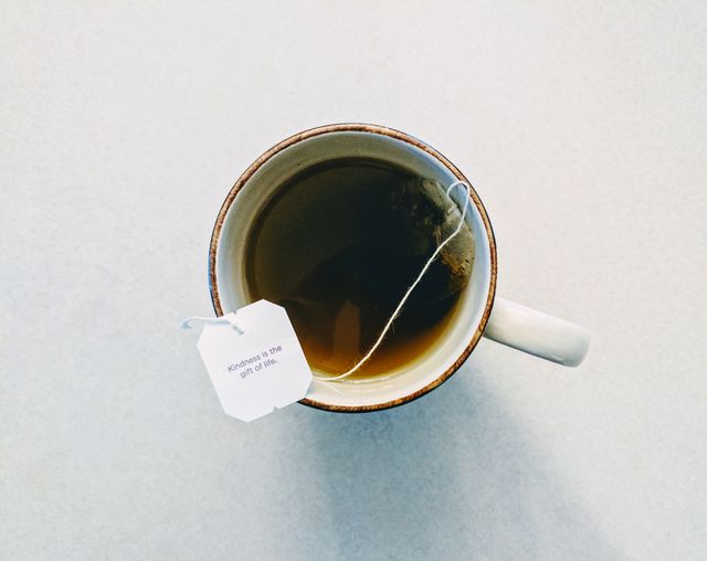 Cup of Herbal Tea With Inspirational Message Tag on Light Background - Download Free Stock Photos Pikwizard.com