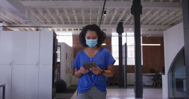 Young Woman Wearing Mask Using Digital Tablet in Modern Office Space - Download Free Stock Images Pikwizard.com