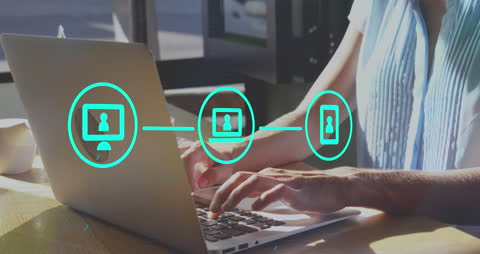 Woman Engaging with Connected Icons on Laptop in Cafe