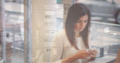 Businesswoman Engaging with Smartphone Amidst Digital Data Interface