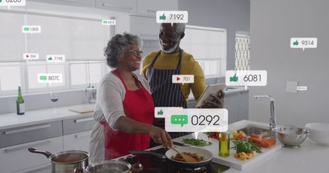 African American Couple Enjoying Cooking with Social Media Interaction