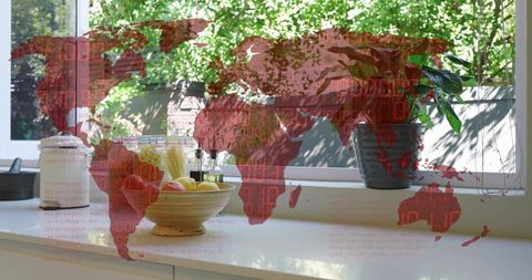 Sunlit kitchen windowsill with fruit bowl and potted plant, red world map overlay, data code