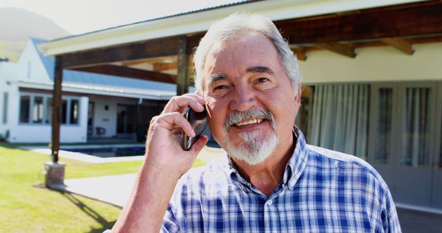 Smiling Elderly Man Talking on Smartphone Outdoors - Download Free Stock Images Pikwizard.com