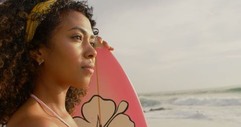 African American Woman with Surfboard on Sunny Beach - Download Free Stock Images Pikwizard.com