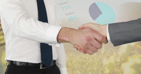 Businessmen Shaking Hands with Financial Graphs Overlay - Download Free Stock Images Pikwizard.com