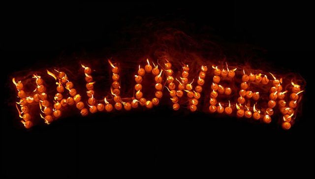 Halloween Flames: Candle-Lit Celebration with Fiery Text