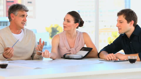 Team of Architects Collaborating on Project Design