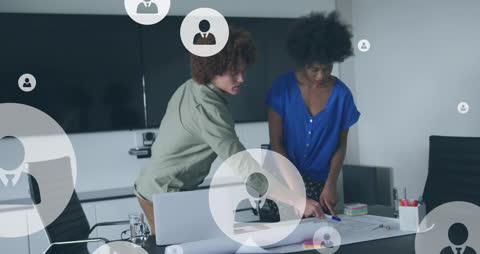 Colleagues Collaborating with Digital Icons Floating