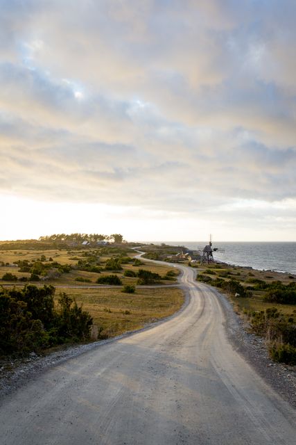Scenic Coastal Road at Sunrise with Skies and Ocean Waves - Download Free Stock Photos Pikwizard.com
