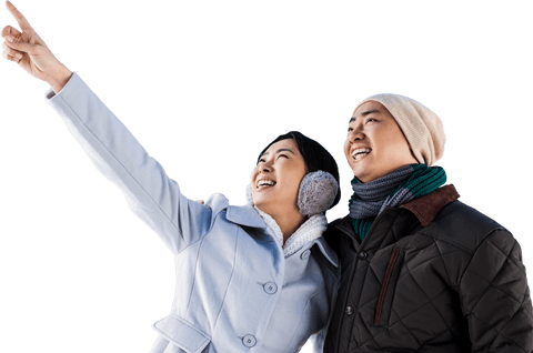 Smiling Couple Pointing Upward in Winter Attire on Transparent Background