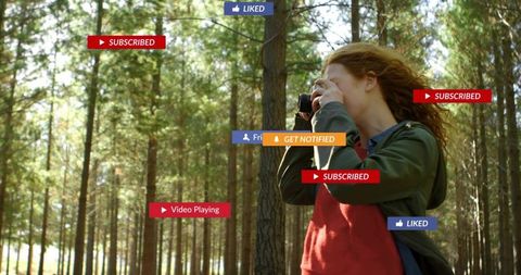 Young woman photographing in sunlit pine forest with social media subscribe and like badges