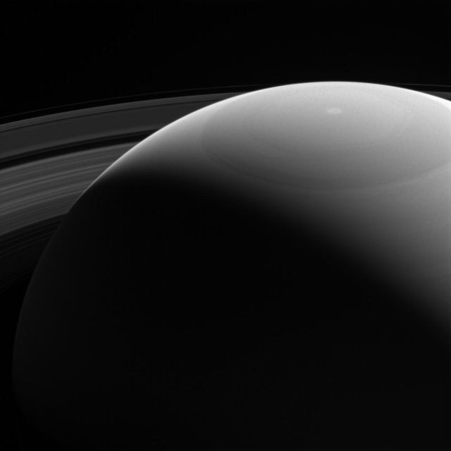 Cassini spacecraft captures stunning view of Saturn's sunlit rings from an elevated angle in violet light on October 28, 2016. Shows planet's massive circular rings as seen from a distance of 810,000 miles. Ideal for use in educational materials, space exploration documentaries, and astronomy-themed presentations.
