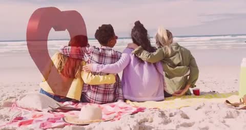 Friends Embracing on Sandy Beach Watching Ocean Waves