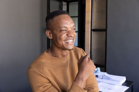 African American Man Smiling at Office Desk