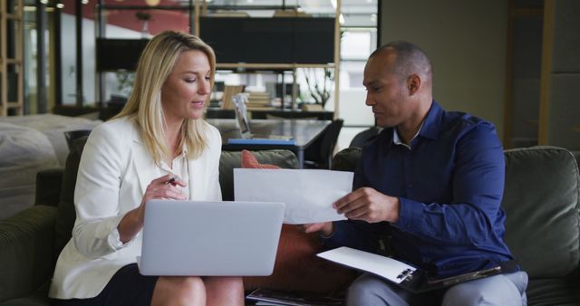 Two Business Professionals Discussing Documents in Office Lounge - Download Free Stock Images Pikwizard.com