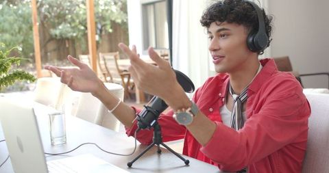 Podcaster engaging audience in home office with hands-free communication