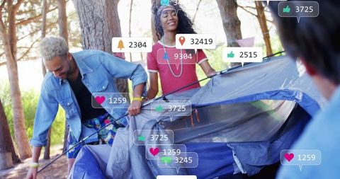 Friends setting up tent in forest with social media elements