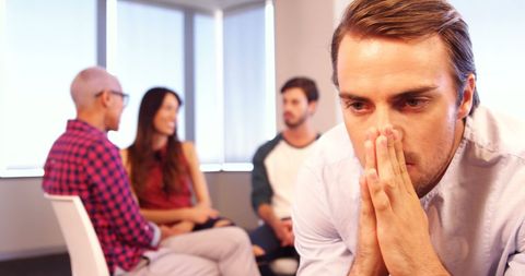 Anxious Man in Supportive Group Setting - Download Free Stock Images Pikwizard.com