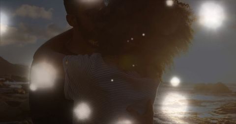 Magical Moments: Biracial Couple Embracing at Sunset Beach