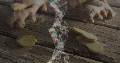 Fresh Ginger Root With Rustic Slices on Wooden Table