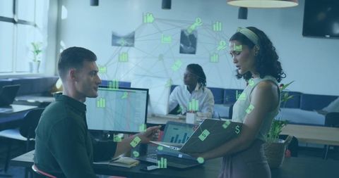 Business Professionals Collaborating on Data Analytics in Office