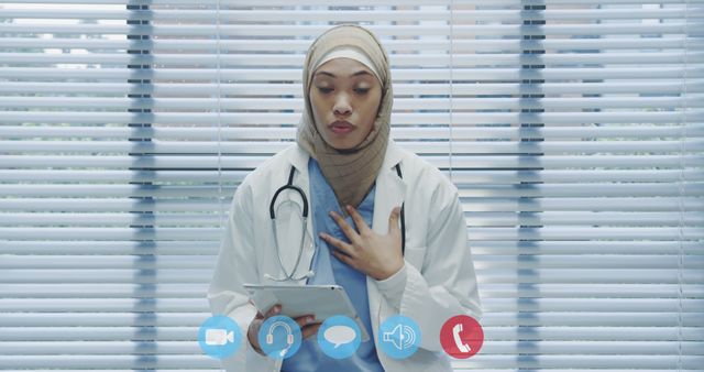 Female Doctor in Hijab Consulting Via Tablet Video Call - Download Free Stock Images Pikwizard.com